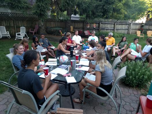 Brock in the cream color shirt at the end of the table with cap on  Brock in the cream color shirt at the end of the table with cap on