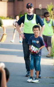 Thompson playing catch with kids who survived the tsunami as a volunteer.