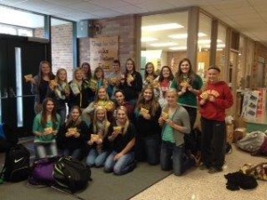 Winner Edgar HS poses with some of the items collected in the county-wide food drive.