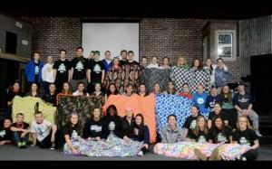 Students from Blaine and Andover with tie blankets made for a local women's shelter.