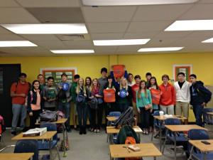 Mosley HS Huddle members display Manna Bags they assembled for their beach ministry.