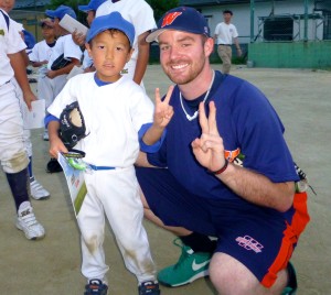 Thompson with a young participant at a baseball outreach clinic in Ishinomaki, a town in the northeast that was devastated by the tsunami.