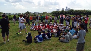 Professional Japanese baseball player Matt Murton teaching hitting at a baseball outreach clinic in Tokyo.