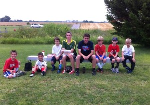 Brazil at Power Camp with campers and a cast on his arm from an injury the night before.