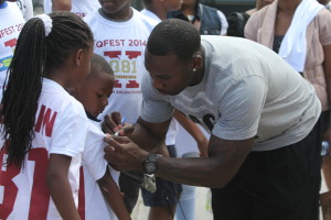 Anquan Boldin signing autographs at one of his foundation's events.